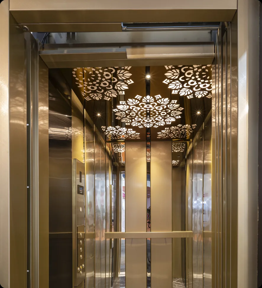 Lift cabin interior with a decorative lit ceiling