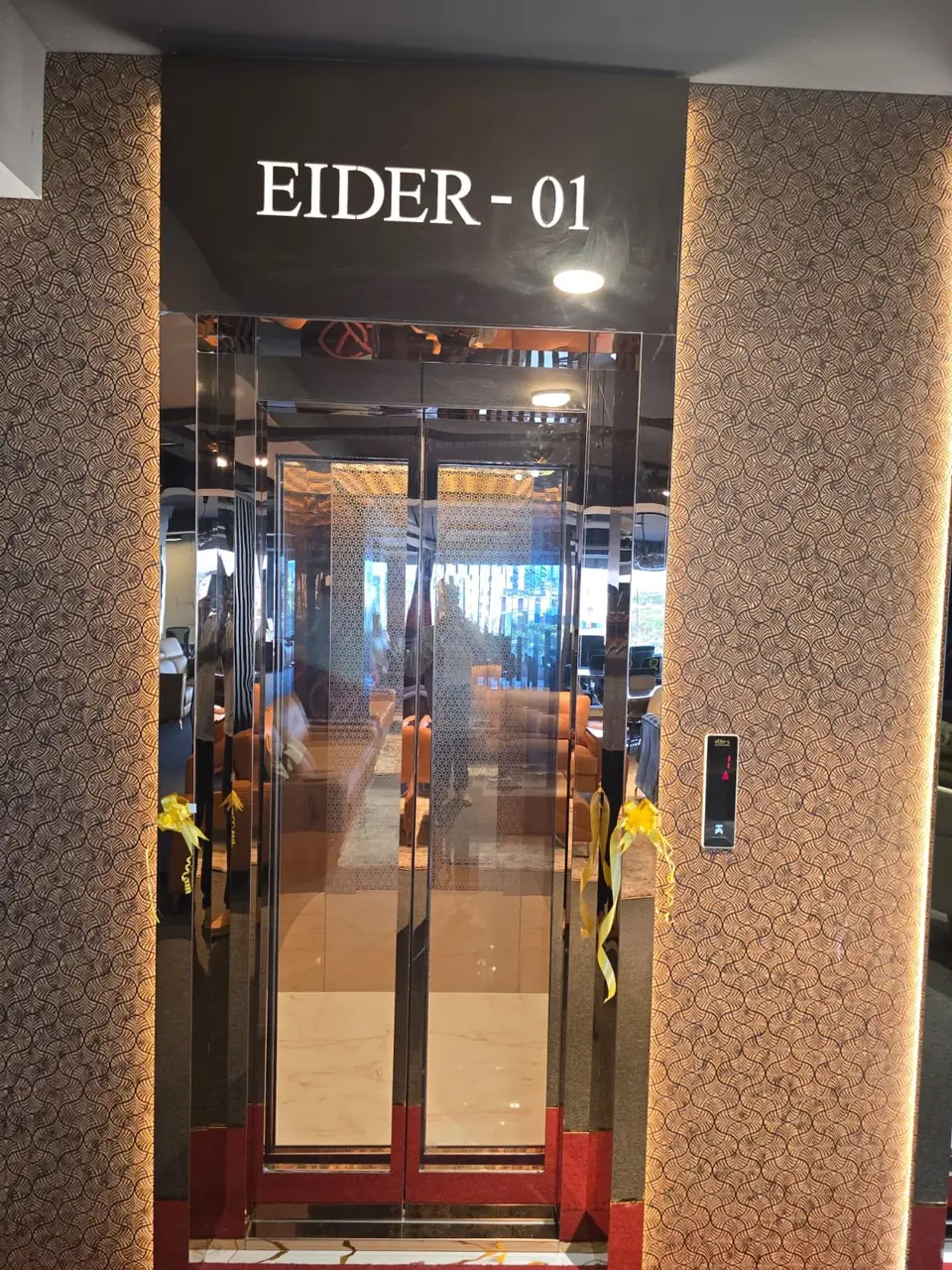 Entrance of the EIDER-01 lift with decorative surround