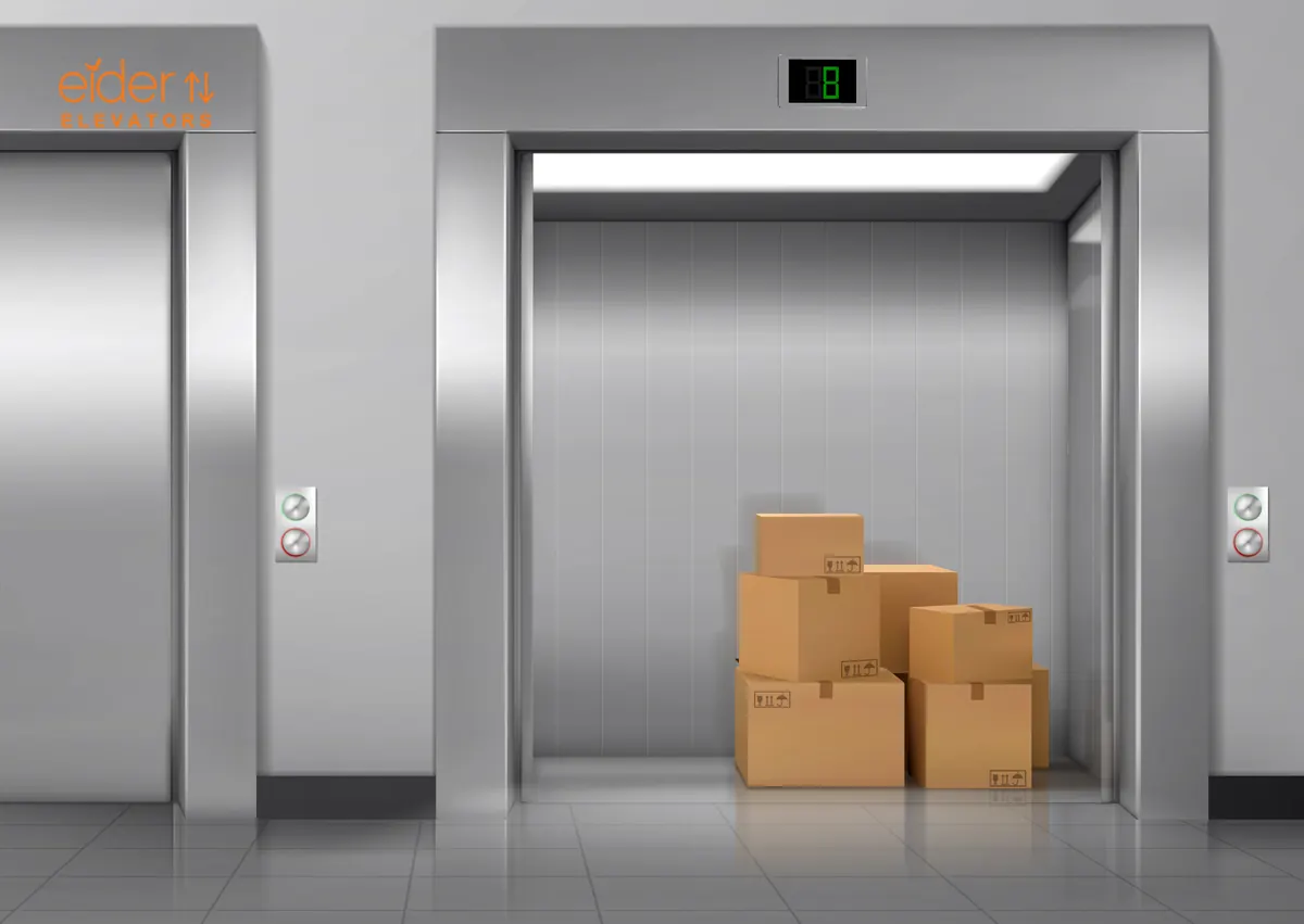 Goods lift with cartons inside a steel cabin